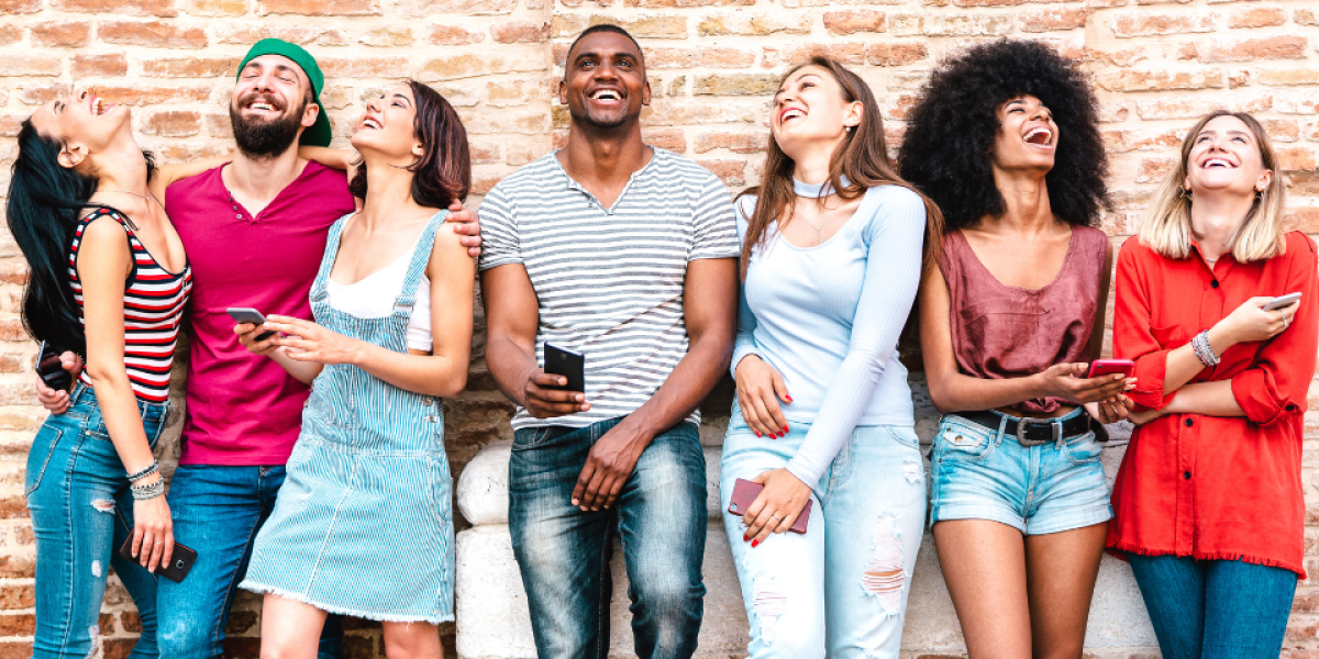 life insurance for millennials a diverse group of millennials againts the wall laughing.